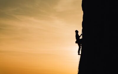 person rock climbing